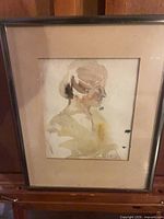 Frontal view of framed watercolor portrait showing artwork, mat and frame