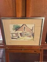 Frontal view of framed watercolor painting