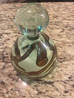 Full view of glass bottle with stopper