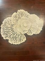 Front view of white metal coral wall art