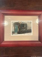 Front view of framed print showing image, mat and wooden frame