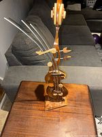 Full view of abstract violin sculpture on table