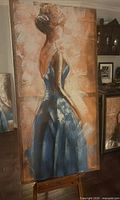 Full view of vertical acrylic painting on easel, showing ballerina figure