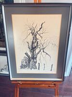 Full view of framed ink tree landscape drawing