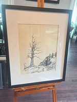 Framed artwork on easel showing full view