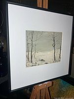 Framed painting on easel full view