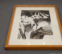 Full view of framed monochrome floral artwork in wood frame