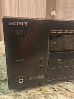 Front left corner showing Sony branding, power button, headphone jack and input labels