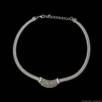 Full view of the sterling silver choker showing woven collar and engraved centerpiece