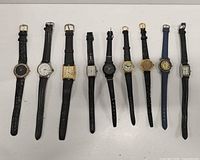 Full view of nine women’s wristwatches laid flat