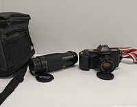 Camera, zoom lens, lens cap, bag overview