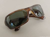 Right front angled view of sunglasses showing frame color and lens tint
