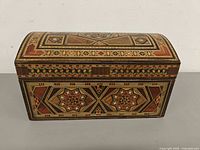 Closed marquetry box front and domed lid showing full pattern