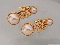Front view of both earrings showing gold-tone metal and faux pearls