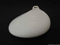 Top and side view showing ovoid body and beaded neck