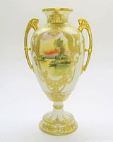Full view of porcelain vase showing shape, handles, decoration