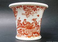 Front view of cachepot showing red Aves bird and floral pattern and gold banding