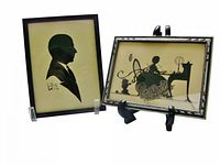 Both framed silhouette artworks on stands