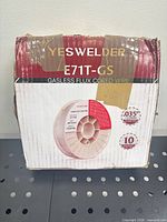 Front view of taped YesWelder box showing product name, model and weight