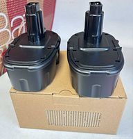 Front view of both battery packs seated on cardboard box