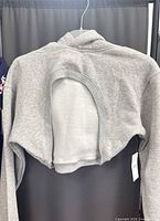 Back view showing oval cut-out and tag