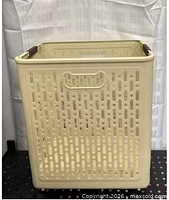 full view of assembled beige collapsible laundry basket