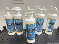 Six Mosquito Barrier RTU spray bottles on shelf
