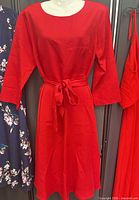 Full front view of red dress showing length, color and belt