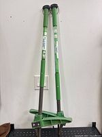 Two identical Expert Gardener garden weeders standing upright