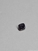 Front view of cushion-cut purple sapphire loose stone
