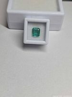 Front view of emerald in display box