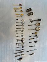 Overall layout of flatware, cocktail forks, napkin rings, tongs, serving pieces