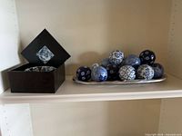 Wood box with small bowl, metal tray with porcelain balls