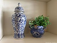 Ginger jar and planter with greenery side by side