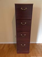 Front view showing full dresser with four drawers and brass handles