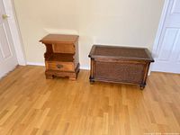 Nightstand and blanket chest side by side on floor