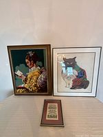 Group shot of all three framed needlework pieces