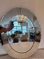 Front view of oval scalloped Venetian mirror