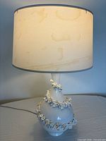 full view of lamp illuminated with shade attached