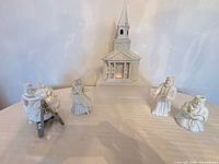 Group shot of church and four figurines