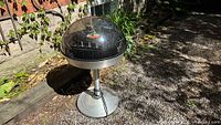 Full view of Electrohome Saturn 861 record player on pedestal outdoors