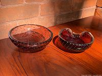 Pair of amethyst bullicante Murano bowls on tabletop