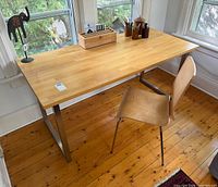 Full view of desk and chair in room