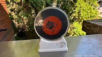 Front view showing Detroit Red Wings logo and Gordie Howe autograph