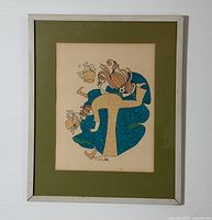Full view of framed lithograph with mat and metal frame