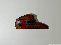Full view of carved thunderbird head plaque
