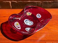 Top view of red Murano bowl showing overall shape and millefiori decoration