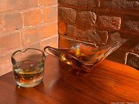 Dish and cup on tabletop showing color and form
