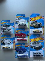 Front view of all seven Hot Wheels blister packs