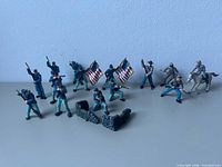 Overall lot showing Union and Confederate figures, flags, mounted cavalry, stone wall